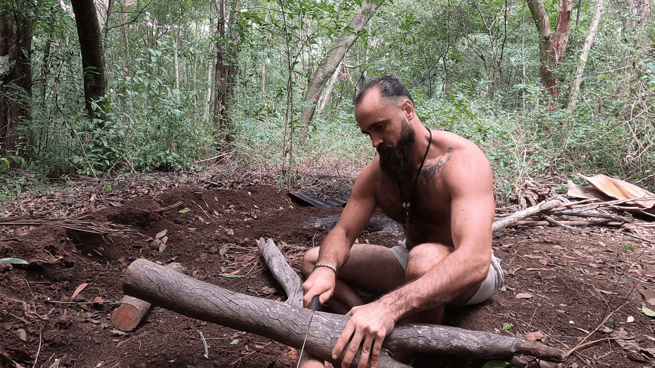 The Australian Viking cutting wood in the forest