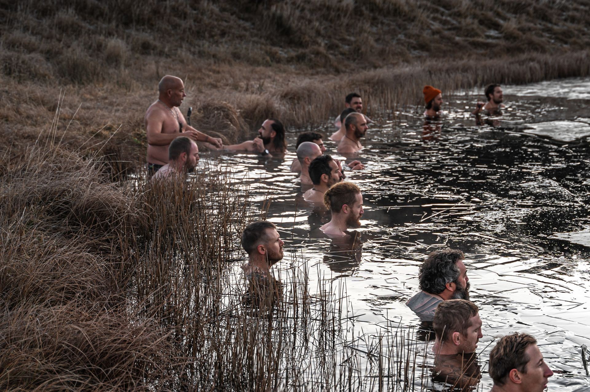 Group bating in lake with ice cold water