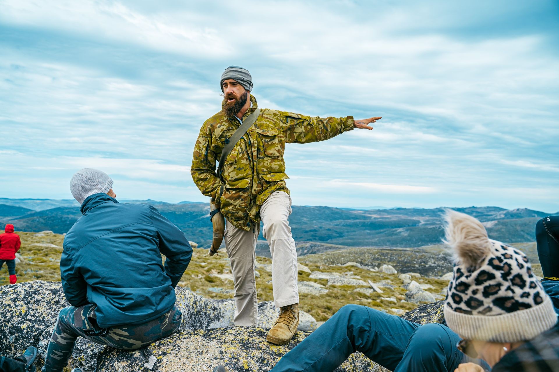 The Australian Viking leading a group outdoors, pointing the way confidently