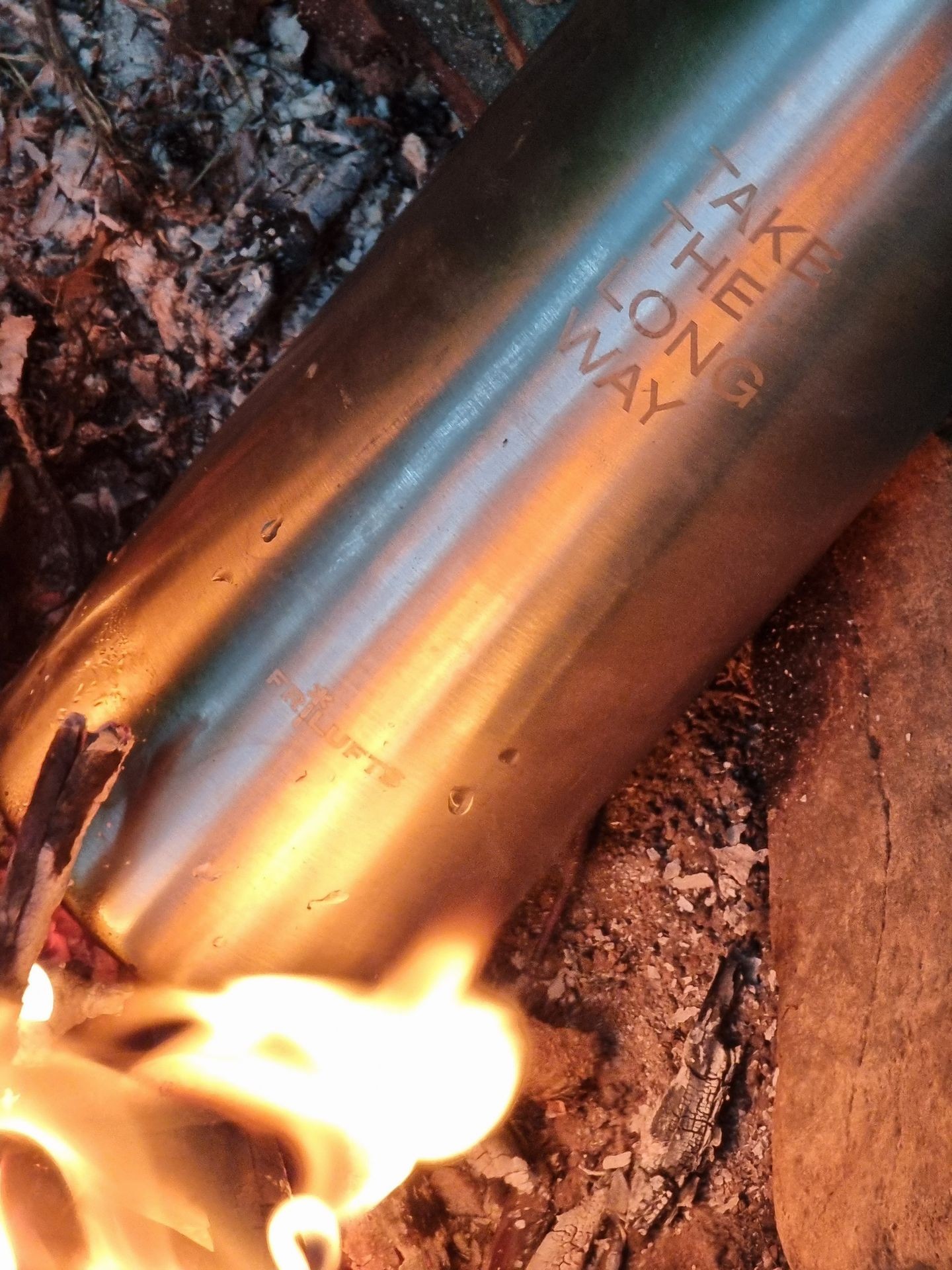 A thermo bottle in the fire, boiling water